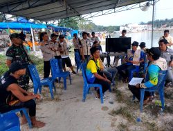 Kapolsek Logas Tanah Darat Pimpin Pengamanan Festival Pacu Jalur Mini 2024 di Objek Wisata Telaga Dapur Umum